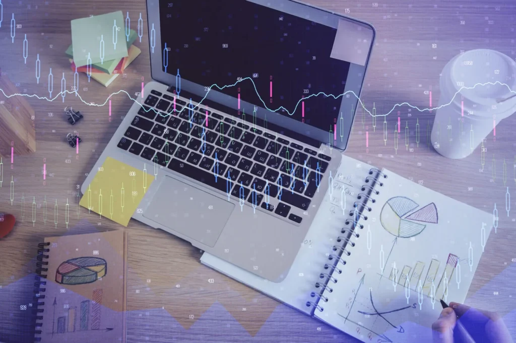 Strategie di Prezzo nel Marketing Digitale 6 Strategie di Prezzo immagine concettuale di un computer con dei grafici in primo piano