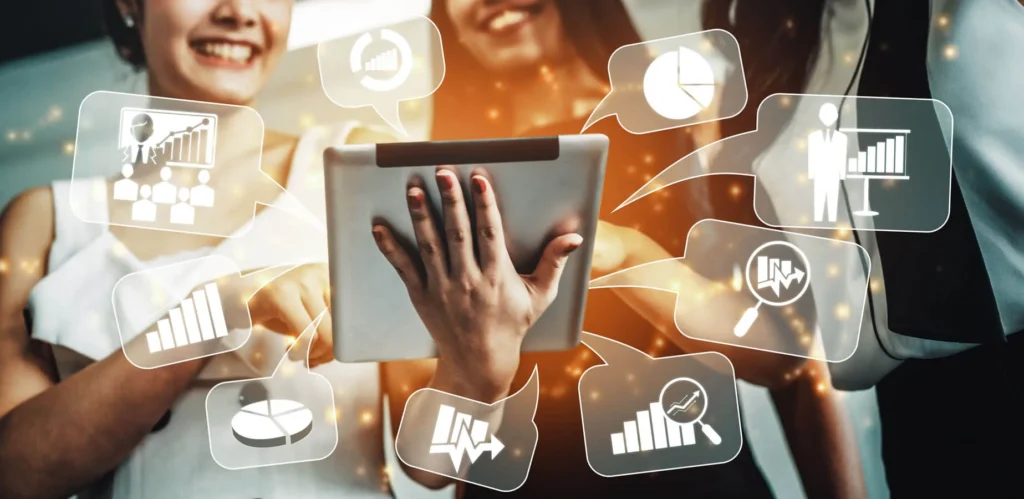 Lead Generation Tattiche e Strategie 7 Lead Generation ragazze con tablet da dove escono icone e grafici