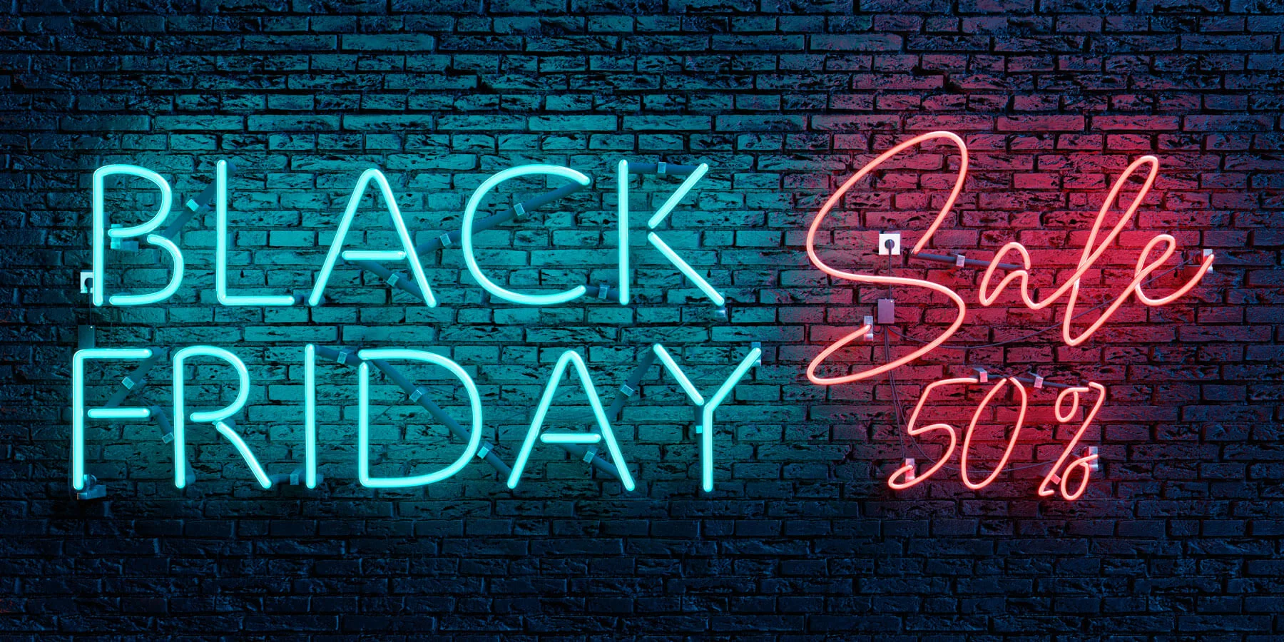 Black Friday e Cyber Monday. Strategie di Vendita 1 Black Friday e Cyber Monday testo al neon verde e rosso su parete di mattoni