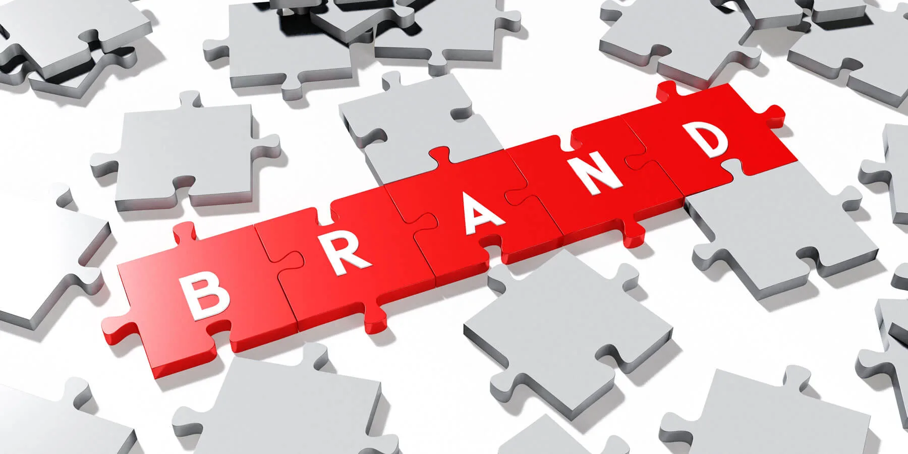 Brand Positioning pezzi puzzle che compongono il testo BRAND
