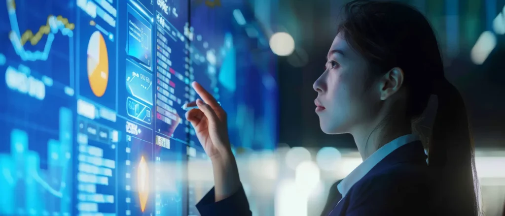 Importanza dei Dati nel Decision Making 7 Dati nel Decision Making ragazza che studia i dati su uno schermo digitale blu