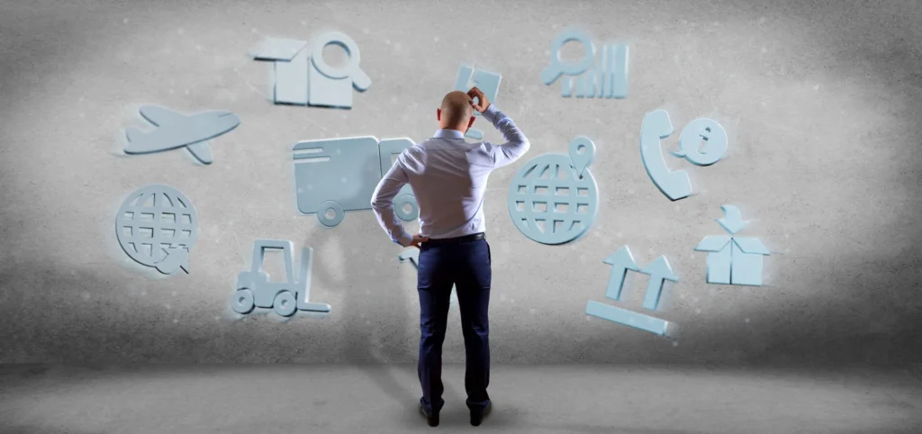 Importanza dei Dati nel Decision Making 1 Dati nel Decision Making ragazzo di spalle che si gratta il capo fissando delle icone appese al muro